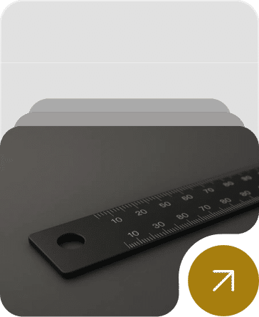 Black anodized metal strip with white laser-marked serial numbers and scales.