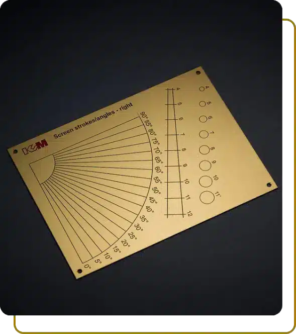 Large rectangular brass calibration plate featuring precise etched angles, measurement scales, and screen stroke guides for K&M.