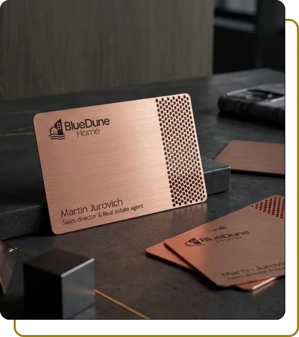 Premium brushed copper-finish metal business card for BlueDune Home with precision laser-cut honeycomb patterns